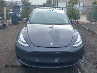 2023 Tesla Model Y Long Range with VIN 7SAYGDEE8PF599254, listed as a IAAI auction lot 41718342 with 24,339 mi miles and . Bid and sale history available at carsss.com. Image 13.