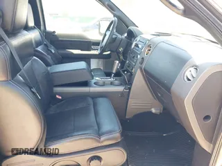 2005 Ford F-150 XLT with VIN 1FTPX14565KC84798, listed as a IAAI auction lot 42064262 with 149,534 mi miles. Bid and sale history available at carsss.com. Image 5.