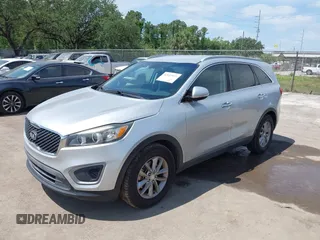 2016 Kia Sorento LX with VIN 5XYPG4A54GG009459, listed as a IAAI auction lot 42113972 with 158,950 mi miles. Bid and sale history available at carsss.com. Image 2.