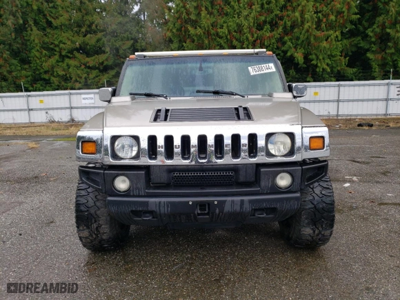 2003 Hummer H2 with VIN 5GRGN23U73H111109, listed as a Copart auction lot 76388144 with 160,179 mi miles and Salvage Title. Bid and sale history available at carsss.com. Image 5.