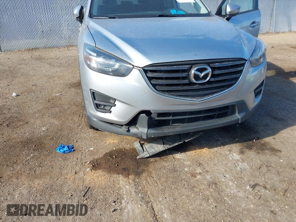 2016 Mazda CX-5 Grand Touring z VIN JM3KE2DY3G0712249, wystawiony jako IAAI lot #37910910 z przebiegiem 262 058 mil mil oraz . Historia ofert i sprzedaży dostępna na DreamBid. Obrazek 6.