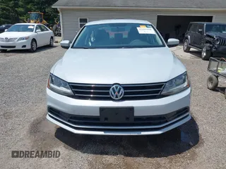 2017 Volkswagen Jetta S z VIN 3VW2B7AJ8HM242804, wystawiony jako IAAI lot #42595566 z przebiegiem 96 551 mil mil oraz . Historia ofert i sprzedaży dostępna na DreamBid. Obrazek 13.