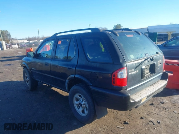2003 Isuzu Rodeo with VIN 4S2CK58W034303195, listed as a IAAI auction lot 41219379 with 215,821 mi miles and . Bid and sale history available at DreamBid. Image 3.