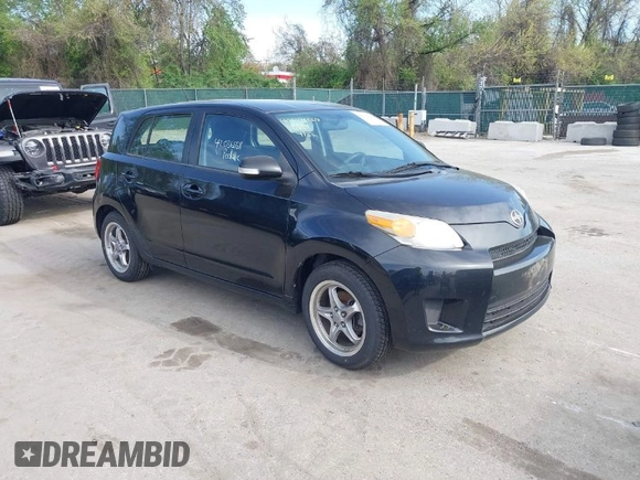 2009 Scion xD with VIN JTKKU10409J041654, listed as a IAAI auction lot 42036558 with 122,661 mi miles. Bid and sale history available at carsss.com. Image 1.