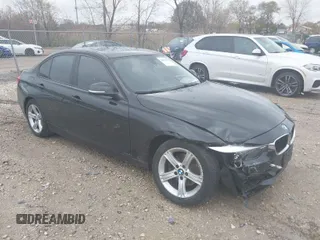 2014 BMW 3 Series 328i xDrive with VIN WBA3B3C54EJ983067, listed as a IAAI auction lot 40857310 with 156,592 mi miles. Bid and sale history available at carsss.com. Image 1.