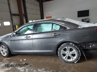 2015 Ford Taurus SEL with VIN 1FAHP2E89FG202589, listed as a IAAI auction lot 41592298 with 105,410 mi miles and . Bid and sale history available at carsss.com. Image 14.