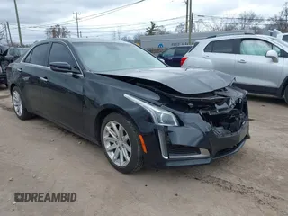 2015 Cadillac CTS Luxury RWD z VIN 1G6AR5SX0F0140112, wystawiony jako IAAI lot #42032894 z przebiegiem 102 784 mil mil oraz . Historia ofert i sprzedaży dostępna na DreamBid. Obrazek 1.