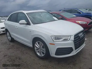 2018 Audi Q3 Premium with VIN WA1ECCFS1JR008297, listed as a IAAI auction lot 40857524 with 117,499 mi miles. Bid and sale history available at carsss.com. Image 1.