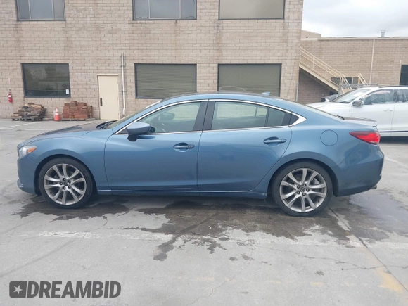 2014 Mazda 6 i Grand Touring with VIN JM1GJ1W64E1133729, listed as a IAAI auction lot 42050222 with 112,464 mi miles and . Bid and sale history available at DreamBid. Image 14.