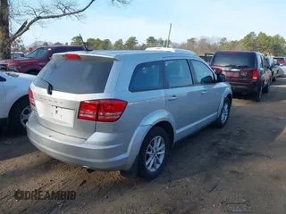 2014 Dodge Journey SE with VIN 3C4PDCAB1ET247218, listed as a IAAI auction lot 41760408 with 148,591 mi miles and . Bid and sale history available at carsss.com. Image 4.