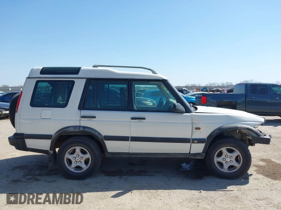 2000 Land Rover Discovery Cloth z VIN SALTY124XYA262828, wystawiony jako IAAI lot #41769729 z przebiegiem 215 711 mil mil oraz . Historia ofert i sprzedaży dostępna na DreamBid. Obrazek 14.
