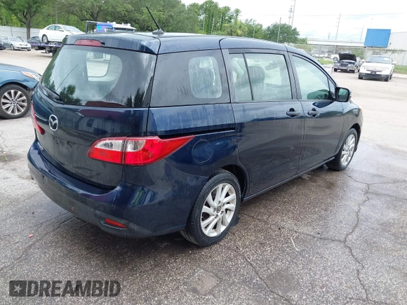 2014 Mazda 5 Sport with VIN JM1CW2BL6E0169672, listed as a IAAI auction lot 42422459 with 212,179 mi miles and . Bid and sale history available at DreamBid. Image 4.