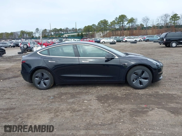 2019 Tesla Model 3 Mid Range with VIN 5YJ3E1EA2KF395549, listed as a IAAI auction lot 41895977 with 97,108 mi miles and . Bid and sale history available at carsss.com. Image 13.