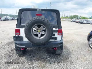 2012 Jeep Wrangler Sport z VIN 1C4AJWAG5CL171961, wystawiony jako IAAI lot #42590232 z przebiegiem 126 372 mil mil oraz . Historia ofert i sprzedaży dostępna na DreamBid. Obrazek 16.