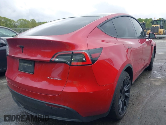 2021 Tesla Model Y Long Range with VIN 5YJYGDEE5MF085032, listed as a IAAI auction lot 41982925 with 64,541 mi miles and . Bid and sale history available at DreamBid. Image 4.