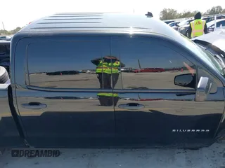 2014 Chevrolet Silverado 1500 LT with VIN 3GCUKREH8EG210945, listed as a IAAI auction lot 41718435 with 106,320 mi miles and . Bid and sale history available at DreamBid. Image 13.