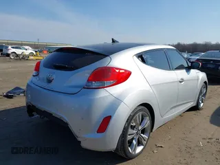 2012 Hyundai Veloster w/Black Int with VIN KMHTC6AD7CU063968, listed as a IAAI auction lot 41764263 with 83,634 mi miles and . Bid and sale history available at DreamBid. Image 4.