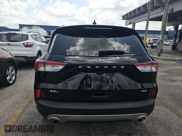 2021 Ford Escape SEL Hybrid with VIN 1FMCU0CZ4MUA54097, listed as a IAAI auction lot 42566428 with 45,342 mi miles and . Bid and sale history available at DreamBid. Image 2.
