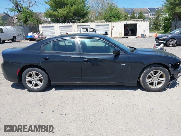 2015 Dodge Charger SE with VIN 2C3CDXBG9FH790573, listed as a IAAI auction lot 42142908 with 195,182 mi miles and . Bid and sale history available at carsss.com. Image 14.