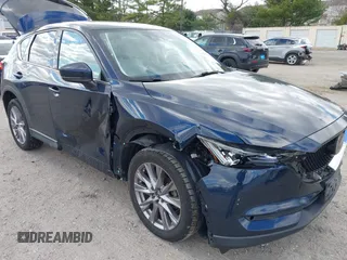 2019 Mazda CX-5 Grand Touring with VIN JM3KFBDM2K0603400, listed as a IAAI auction lot 42051135 with 59,448 mi miles and . Bid and sale history available at DreamBid. Image 6.