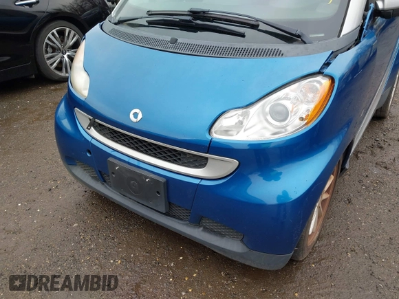 2009 Smart fortwo Passion z VIN WMEEK31X39K225478, wystawiony jako IAAI lot #41510522 z przebiegiem Nie podano mil oraz . Historia ofert i sprzedaży dostępna na DreamBid. Obrazek 6.