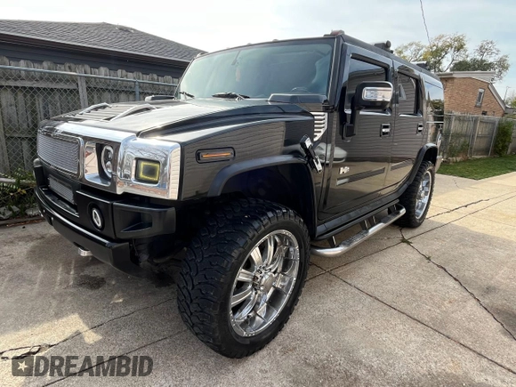 2004 Hummer H2 with VIN 5GRGN23U14H115951, listed as a Copart auction lot 79581694 with 88,845 mi miles and Salvage Title. Bid and sale history available at carsss.com. Image 2.