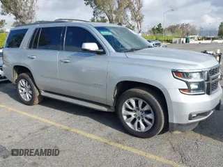 2015 Chevrolet Tahoe LT with VIN 1GNSCBKC8FR114732, listed as a IAAI auction lot 41900157 with 107,298 mi miles and . Bid and sale history available at DreamBid. Image 1.