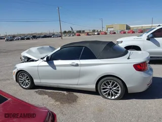 2015 BMW 2 Series 228i with VIN WBA1K5C50FV474011, listed as a IAAI auction lot 41805879 with 83,489 mi miles. Bid and sale history available at carsss.com. Image 13.