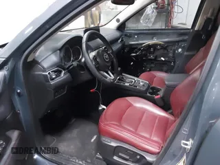 2021 Mazda CX-5 Touring z VIN JM3KFBCM4M0459465, wystawiony jako IAAI lot #41059836 z przebiegiem 74 645 mil mil oraz . Historia ofert i sprzedaży dostępna na DreamBid. Obrazek 5.