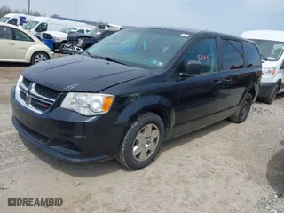 2012 Dodge Grand Caravan SE with VIN 2C4RDGBG2CR351999, listed as a IAAI auction lot 42075245 with 149,997 mi miles. Bid and sale history available at carsss.com. Image 2.