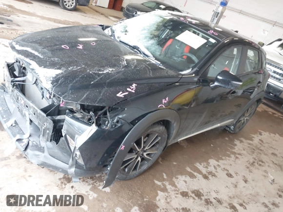 2016 Mazda CX-3 Grand Touring with VIN JM1DKFD71G0132801, listed as a IAAI auction lot 41573276 with 90,000 mi miles. Bid and sale history available at carsss.com. Image 2.