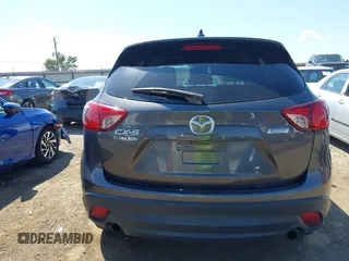 2014 Mazda CX-5 Grand Touring with VIN JM3KE2DY8E0383206, listed as a IAAI auction lot 40205756 with 120,231 mi miles. Bid and sale history available at carsss.com. Image 16.