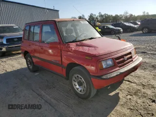 1998 Suzuki Sidekick JS z VIN 2S3TE02V3W6406072, wystawiony jako Copart lot #75855544 z przebiegiem 120 359 mil mil oraz Szkody całkowita. Historia ofert i sprzedaży dostępna na DreamBid. Obrazek 4.