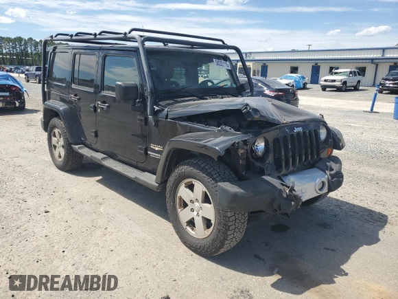 2012 Jeep Wrangler Unlimited Sahara with VIN 1C4HJWEG5CL205826, listed as a Copart auction lot 58222115 with 98,940 mi miles and Salvage title. Bid and sale history available at DreamBid. Image 4.