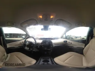2022 Toyota Prius L Eco with VIN JTDKAMFUXN3157225, listed as a IAAI auction lot 39292379 with 59,333 mi miles and . Bid and sale history available at DreamBid. Image 19.