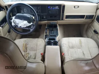 1996 Jeep Cherokee Sport with VIN 1J4FJ68S0TL288244, listed as a Copart auction lot 87801025 with 218,356 mi miles and Salvage Title. Bid and sale history available at carsss.com. Image 8.