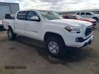 2021 Toyota Tacoma SR with VIN 3TYAX5GN5MT015924, listed as a Copart auction lot 59523615 with 79,693 mi miles and Salvage title. Bid and sale history available at DreamBid. Image 4.