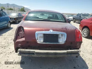 2000 Lincoln Town Car Signature with VIN 1LNHM82W2YY809189, listed as a Copart auction lot 59812665 with 148,236 mi miles and Salvage title. Bid and sale history available at DreamBid. Image 6.