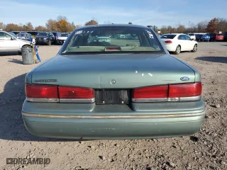 1997 Ford Crown Victoria with VIN 2FALP73W6VX173232, listed as a Copart auction lot 77805094 with 228,871 mi miles and Salvage Title. Bid and sale history available at carsss.com. Image 6.