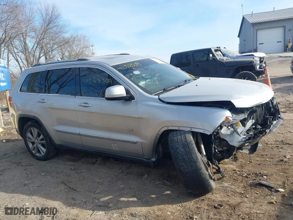 2011 Jeep Grand Cherokee Laredo with VIN 1J4RR4GTXBC678304, listed as a IAAI auction lot 41088309 with 139,559 mi miles. Bid and sale history available at carsss.com. Image 13.