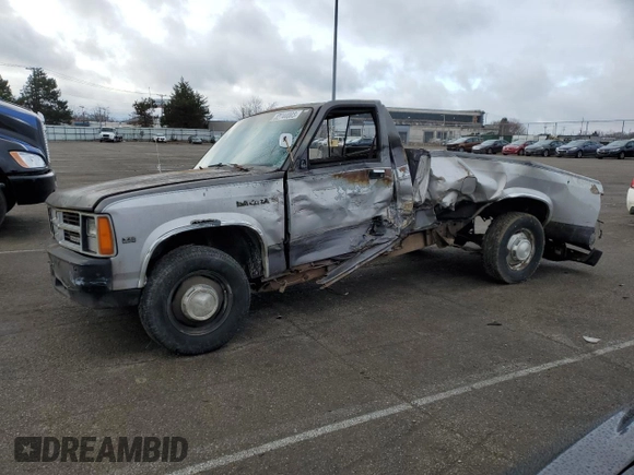 1989 Dodge Dakota S z VIN 1B7GL26X9KS129335, wystawiony jako Copart lot #82744003 z przebiegiem 174 152 mil mil oraz Szkoda całkowita • Salvage title. Historia ofert i sprzedaży dostępna na DreamBid. Obrazek 1.