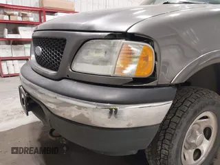 2002 Ford F-150 XL with VIN 1FTRX18W92KA81797, listed as a IAAI auction lot 42250147 with 162,918 mi miles and . Bid and sale history available at DreamBid. Image 6.