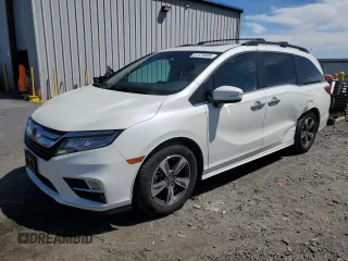 2018 Honda Odyssey Touring with VIN 5FNRL6H8XJB018438, listed as a Copart auction lot 61876505 with 104,581 mi miles and Salvage title. Bid and sale history available at DreamBid. Image 1.