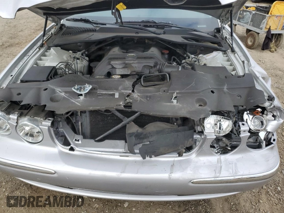 2004 Jaguar XJ with VIN SAJEA74C34SG09548, listed as a Copart auction lot 71754774 with 142,804 mi miles and Salvage Title. Bid and sale history available at DreamBid. Image 11.