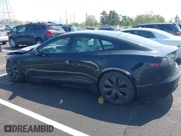 2022 Tesla Model S z VIN 5YJSA1E56NF490064, wystawiony jako IAAI lot #41858477 z przebiegiem Nie podano mil oraz . Historia ofert i sprzedaży dostępna na DreamBid. Obrazek 14.