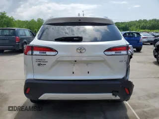 2023 Toyota Corolla Cross LE with VIN 7MUCAAAG2PV053730, listed as a Copart auction lot 54825035 with 33,313 mi miles and Salvage title. Bid and sale history available at DreamBid. Image 6.