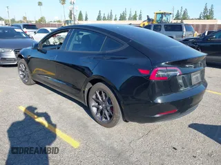 2018 Tesla Model 3 Long Range Battery with VIN 5YJ3E1EA5JF171948, listed as a IAAI auction lot 41993887 with 42,370 mi miles and . Bid and sale history available at DreamBid. Image 3.