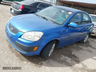 2008 Kia Rio LX with VIN KNADE123486430555, listed as a IAAI auction lot 41875641 with 121,280 mi miles. Bid and sale history available at carsss.com. Image 2.