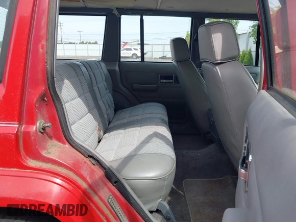 1989 Jeep Cherokee with VIN 1J4FT38L3KL577747, listed as a IAAI auction lot 42577047 with 144,312 mi miles and . Bid and sale history available at DreamBid. Image 8.