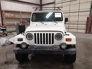 1997 Jeep Wrangler Sahara with VIN 1J4FY49S3VP529837, listed as a IAAI auction lot 41752978 with 138,024 mi miles. Bid and sale history available at carsss.com. Image 12.